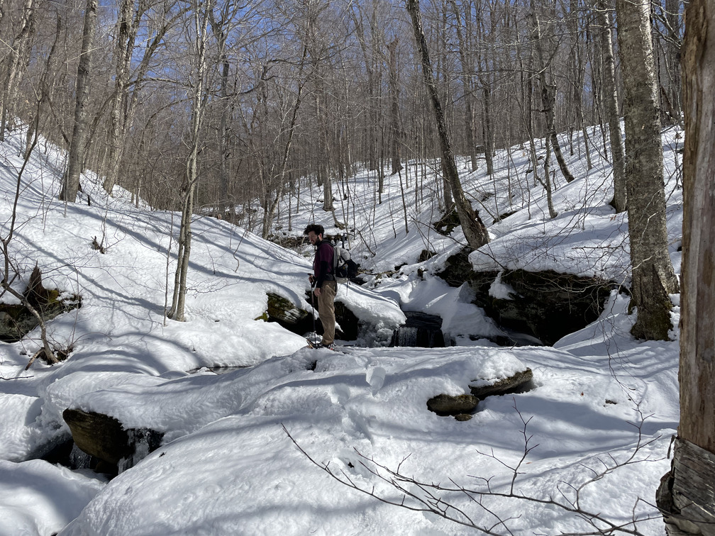 John crossing an ice bridge